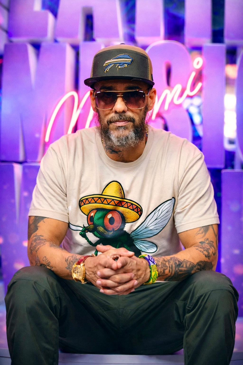 Don Dinero wearing the official Spanish Fly movie T-shirt at Latin Music Week
