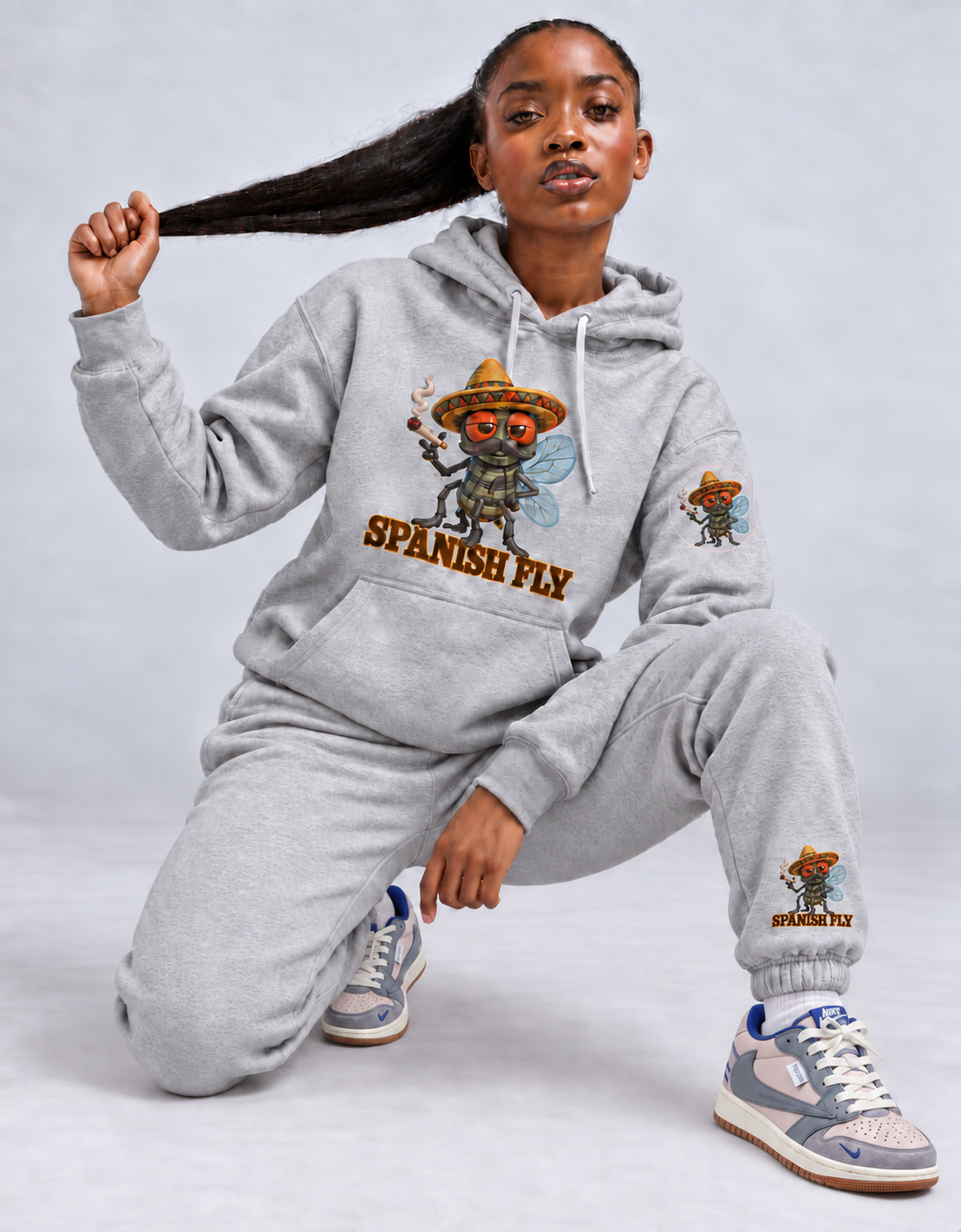 Spanish Fly Carbon Grey joggers styled with gray hoodie with fly-only Pepito left-sleeve print; items sold separately