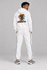 AI visualization: existing Spanish Fly white tracksuit model showing full Pepito Spanish Fly back logo; back stripe removed; jacket and pants included, sneakers excluded